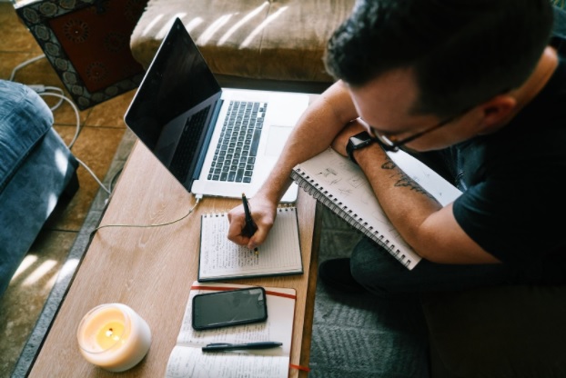 A man writing down ideas