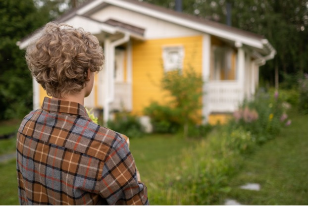 Man standing in front of a house